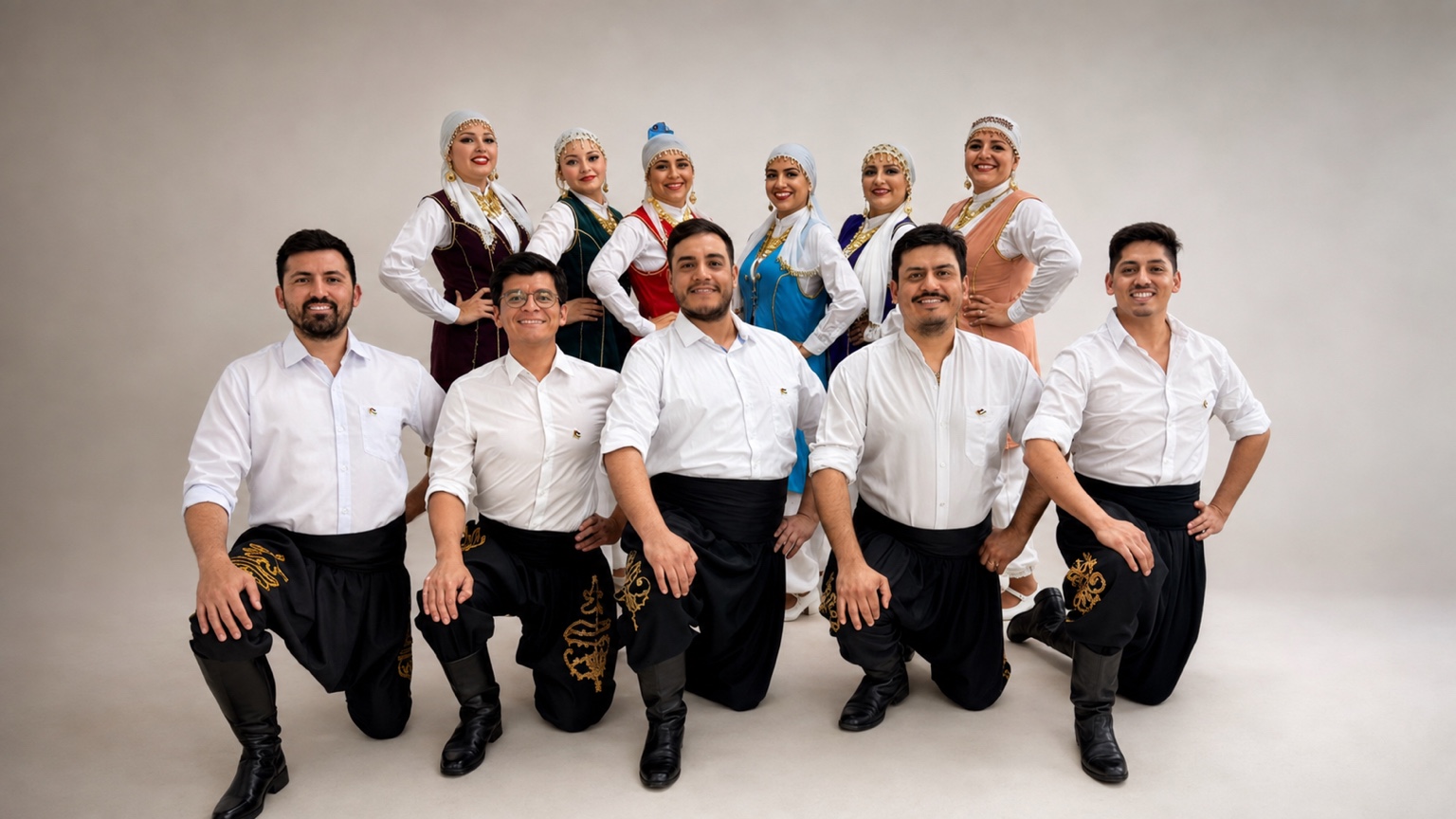 Studio portrait of the Al Ard al Baiida cast in traditional costume